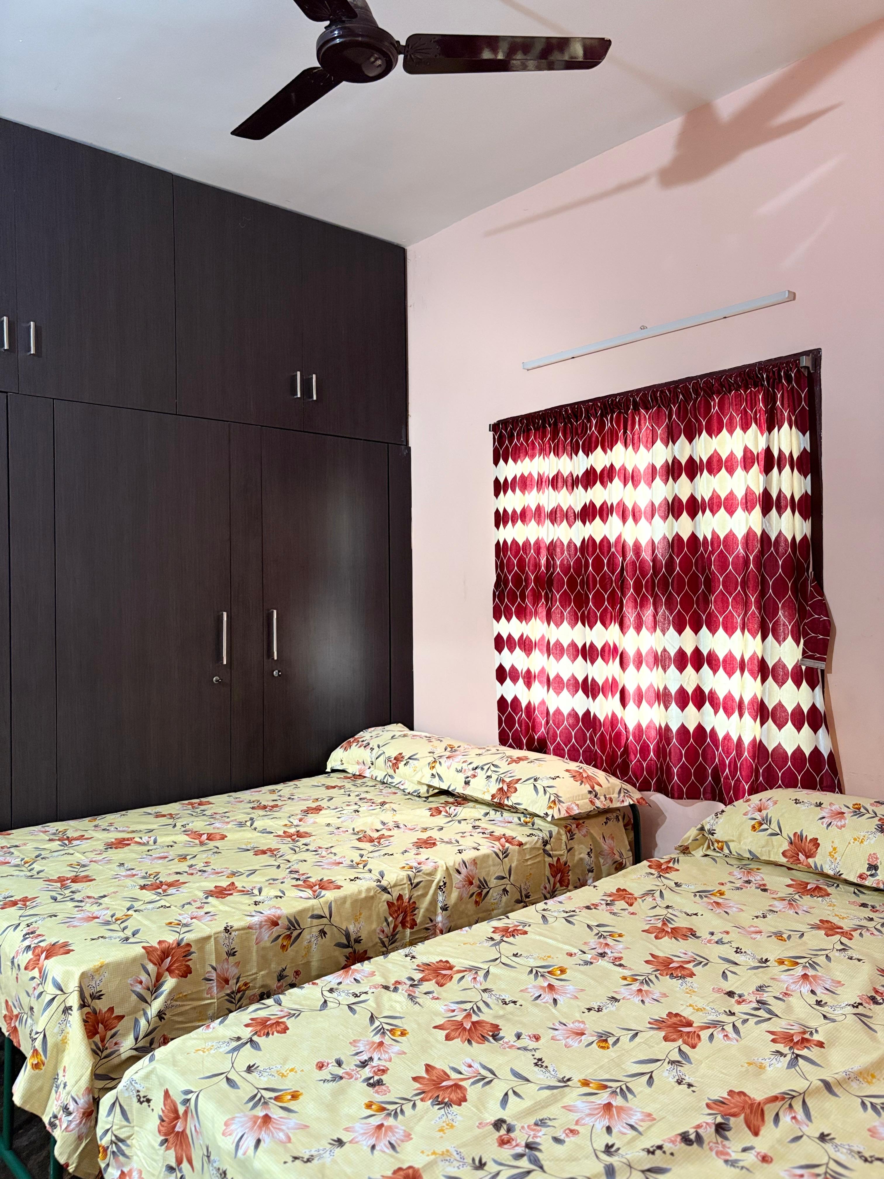 Twin-bed room with large wardrobe