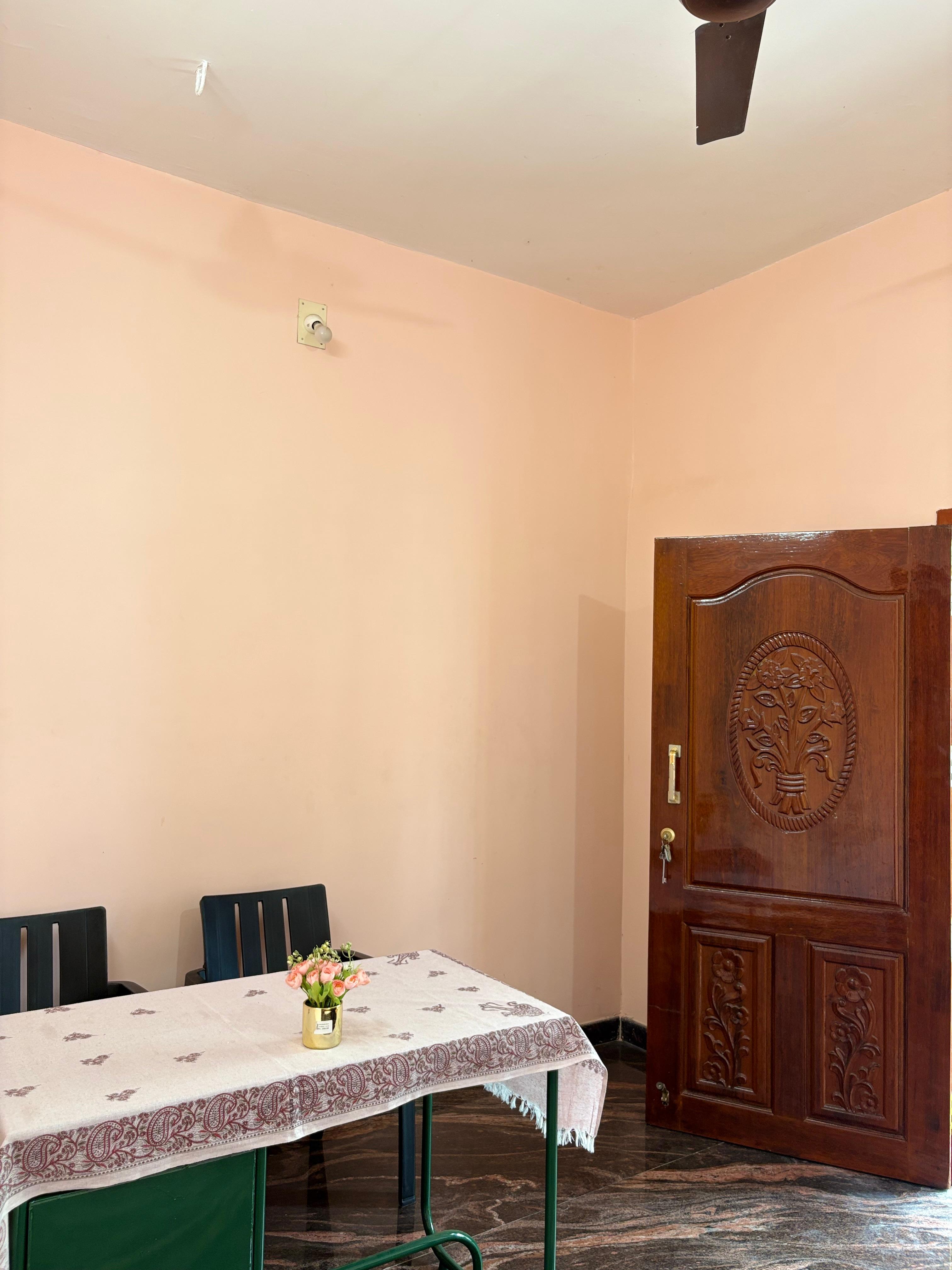 Dining and reception area with teak entrance door